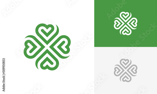 green clover with heart shape logo design vector