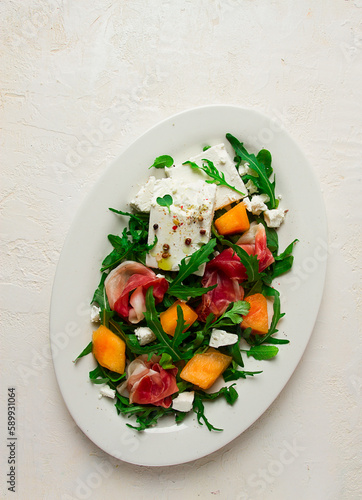 salad, melon with prosciutto, arugula, and cheese, summer salad, vegetarian, homemade, no people,