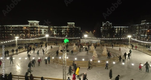 Mariupol. New Year 2022. Before the war. Ice rink. Beautiful decorations of the city. Peaceful city at night in the snow.
