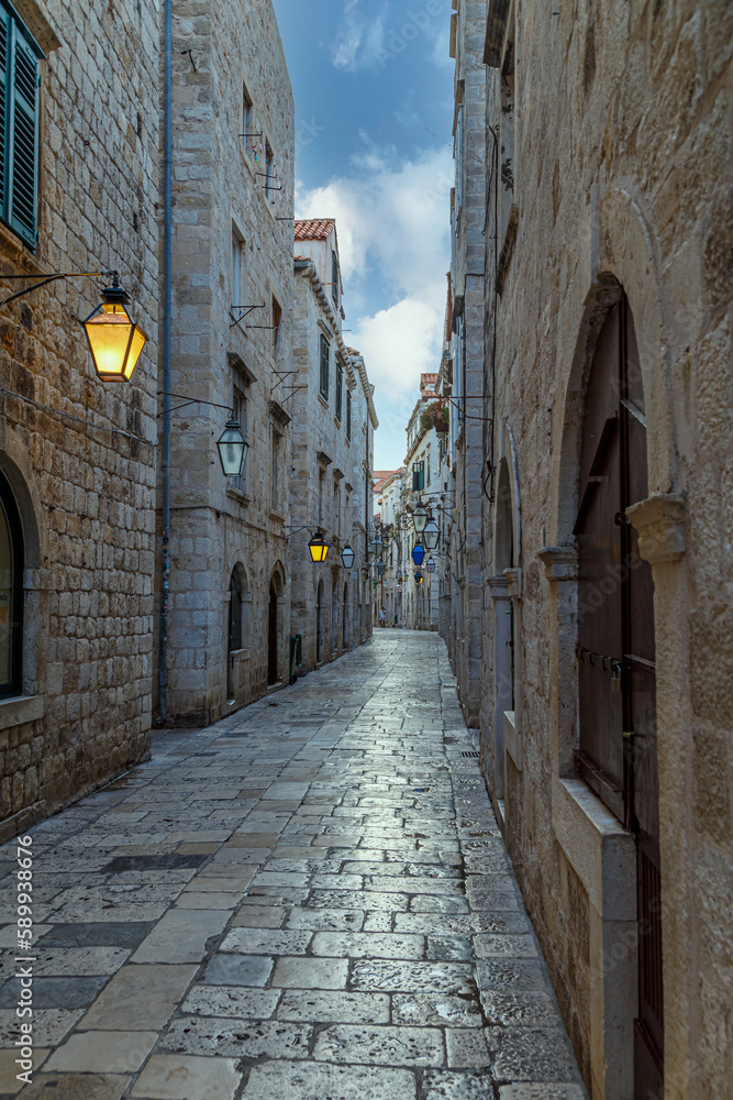 Fototapeta premium Medieval stone street, illuminated by lanterns. Dubrovnik. Croatia. Europe
