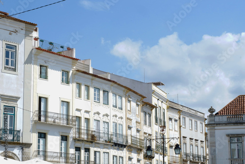 Whitewashed vintage classical buildings downtown Evora, Portugal photo