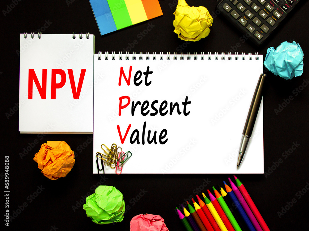 NPV net present value symbol. Concept words NPV net present value on white note on a beautiful black background. Pencil and pen. Calculator. Business and NPV net present value concept. Copy space. NPV net present value symbol. Concept words NPV net present value on white note on a beautiful black background. Pencil and pen. Calculator. Business and NPV net present value concept. Copy space.