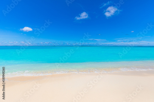 Sunny beach landscape. Relaxing beachfront sand sea waves blue sky horizon. Tranquil freedom Mediterranean tropical nature background. Peaceful happy seascape horizon. Summer travel closeup sunlight