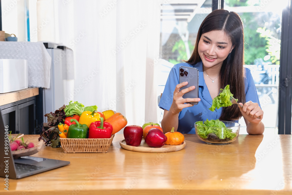 Diet, white-skinned young Asian woman in a blue shirt eating vegetable salad and apples as a healthy diet, opting for junk food. Female nutritionist losing weight. healthy eating concept.