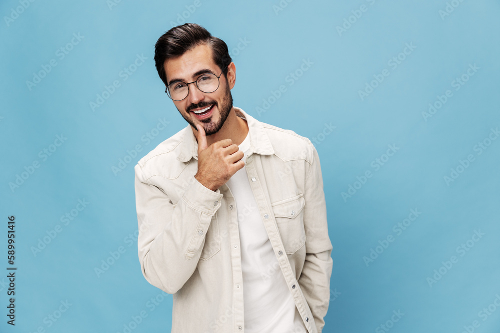Portrait of a stylish man smile glasses for farsightedness and myopia, on a blue background in a white T-shirt, space space