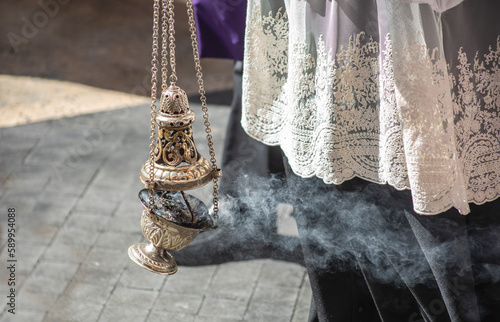 Billede på lærred Detail of altar boy dressed in lace with censer in a Holy Week procession in Mur