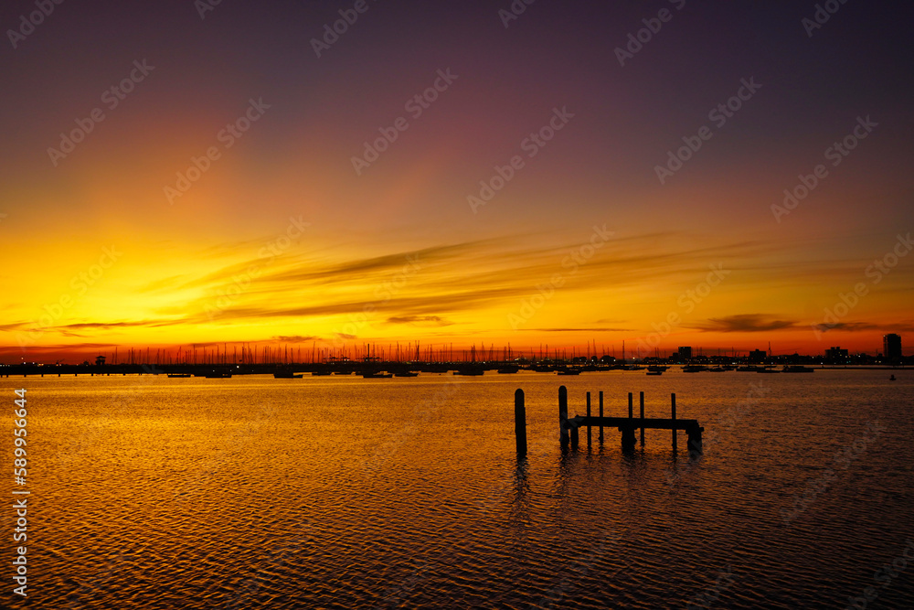 Sunset at the pier of St Kilda Beach, Melbourne, Australia