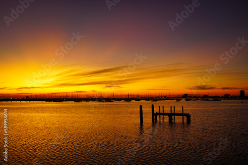 Sunset at the pier of St Kilda Beach, Melbourne, Australia