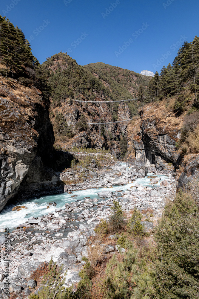 Hillary bridge: legendary suspension bridge over Dush Koshi river, connecting two sides of the valley on the way from Phakding to Namche bazar