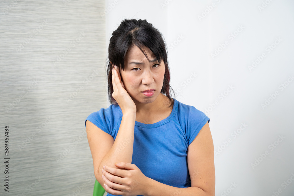 Asian woman having earache. Medicine