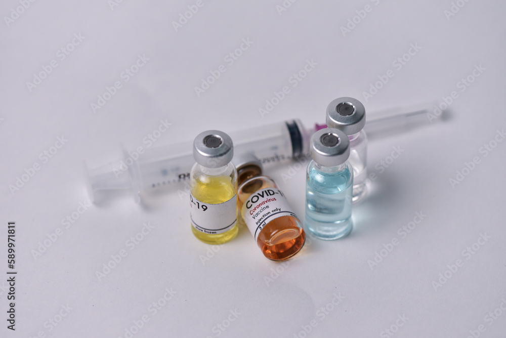 Vaccine bottle. Syringe on white background. Vaccination against quarantine coronavirus or covid-19, virus prevention and infection control. drug therapy concept Vaccine bottle. Syringe on white background. Vaccination against quarantine coronavirus or covid-19, virus prevention and infection control. drug therapy concept