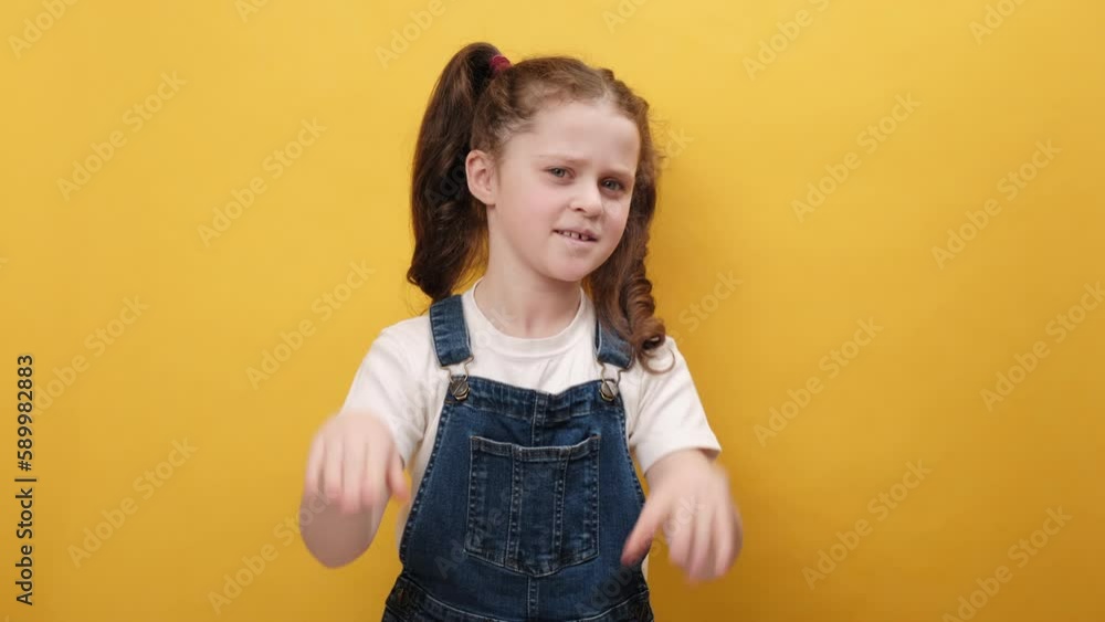 Portrait of little girl kid feeling hopelessness loneliness, nervous breakdown, loses becoming surprised by lottery results bad fortune loss unlucky news, posing over yellow color background in studio Portrait of little girl kid feeling hopelessness loneliness, nervous breakdown, loses becoming surprised by lottery results bad fortune loss unlucky news, posing over yellow color background in studio