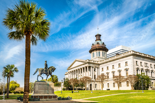 South Carolina State House, in Columbia, SC, and Wade Hampton III Statue on a sunny morning. The South Carolina State House is the building housing the government of the U.S. state of South Carolina