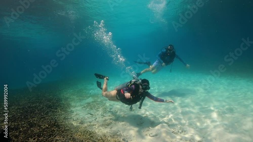 Wallpaper Mural Under Water scuba film from Ko Tao island in southern Thailand - two divers at shallow depth - beautyful sunlight and sandy ocean floor Torontodigital.ca
