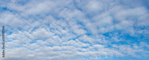 Blue sky with white cirrus clouds  panorama