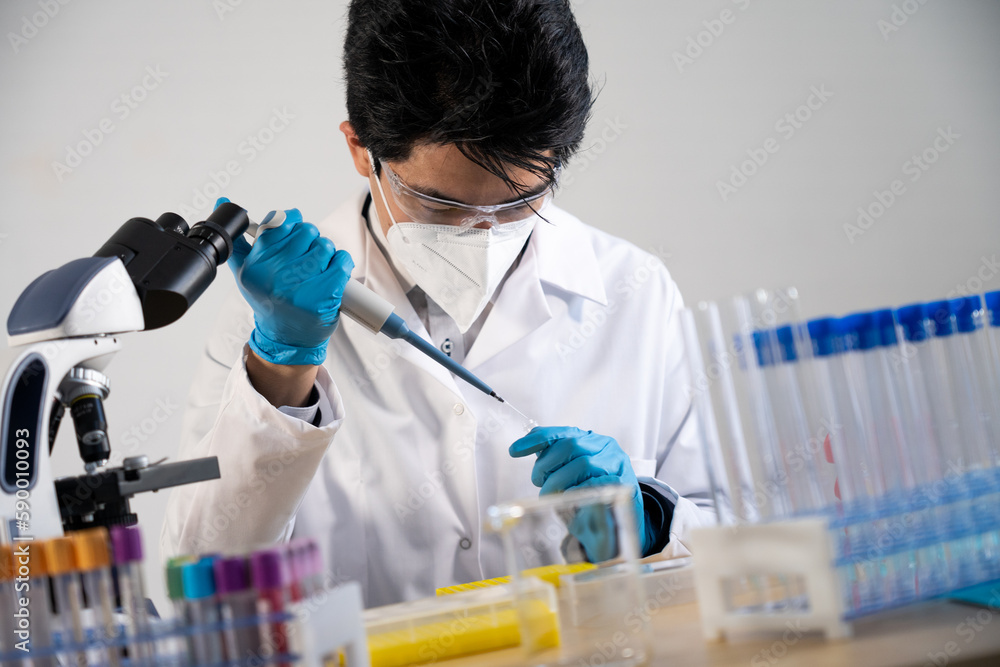 Laboratory assistant conducting experiments for laboratory research. Laboratory assistant conducting experiments for laboratory research.