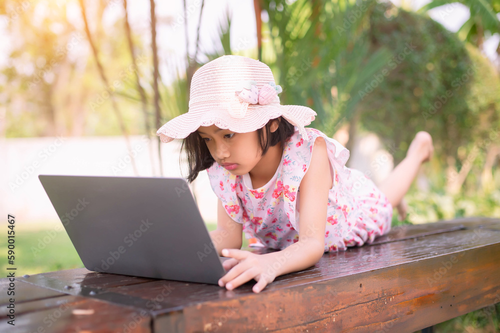 Girl in park on laptop. Web design mockup