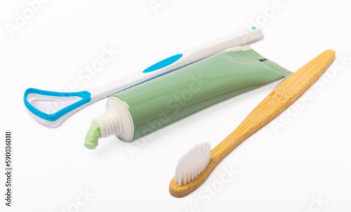 Tube of toothpaste and toothbrush isolated on white background. Close-up. Prevention of dental plaque and caries. Fresh breath. Dentistry concept. Oral care.