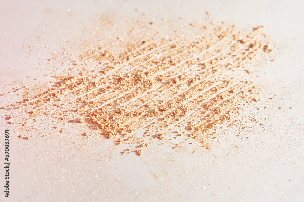 A smear of face powder, on a white background. Minimalistic modern cosmetic scene of bronzer or shadows, top view with space to copy. High quality photo