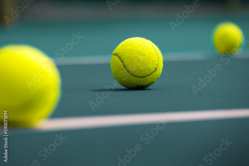 Tennis  ball on the blue-coated cour © Павел Мещеряков