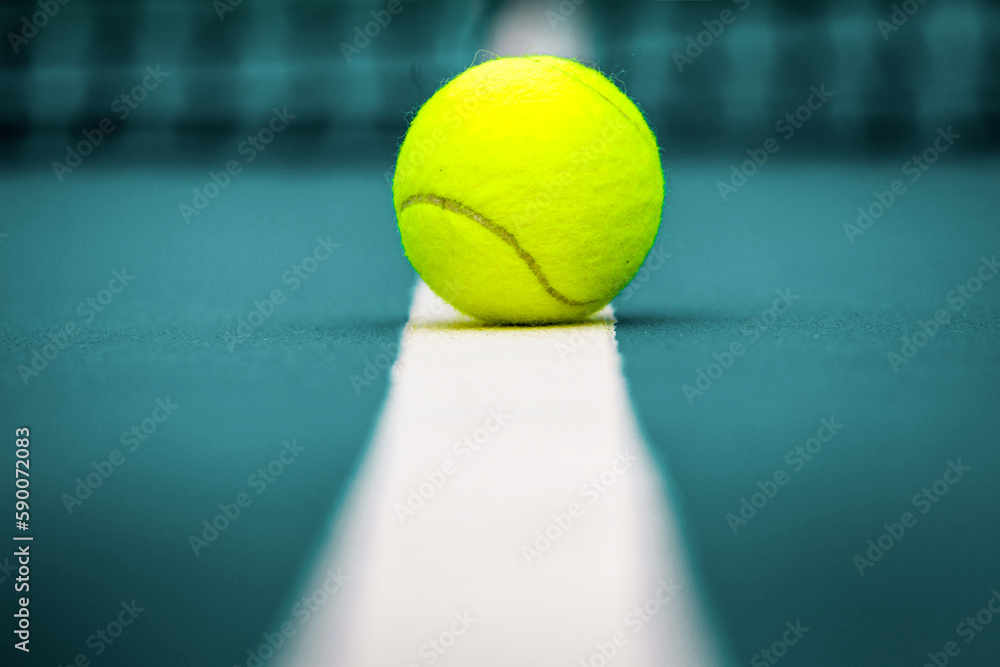 Tennis  ball on the blue-coated cour