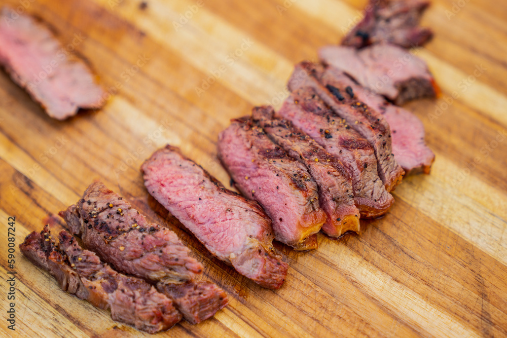 Cut steak pieces on wood cut board Cut steak pieces on wood cut board