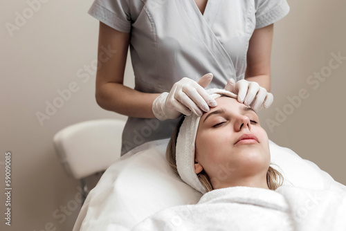 Close-up Of Woman Getting Peeling Treatment At Cosmetic Beauty salon