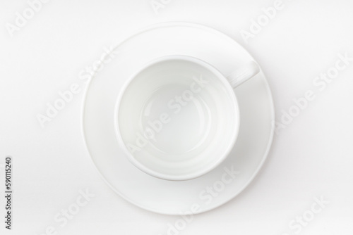 A white cup on a white background. Blank cup. Top view.