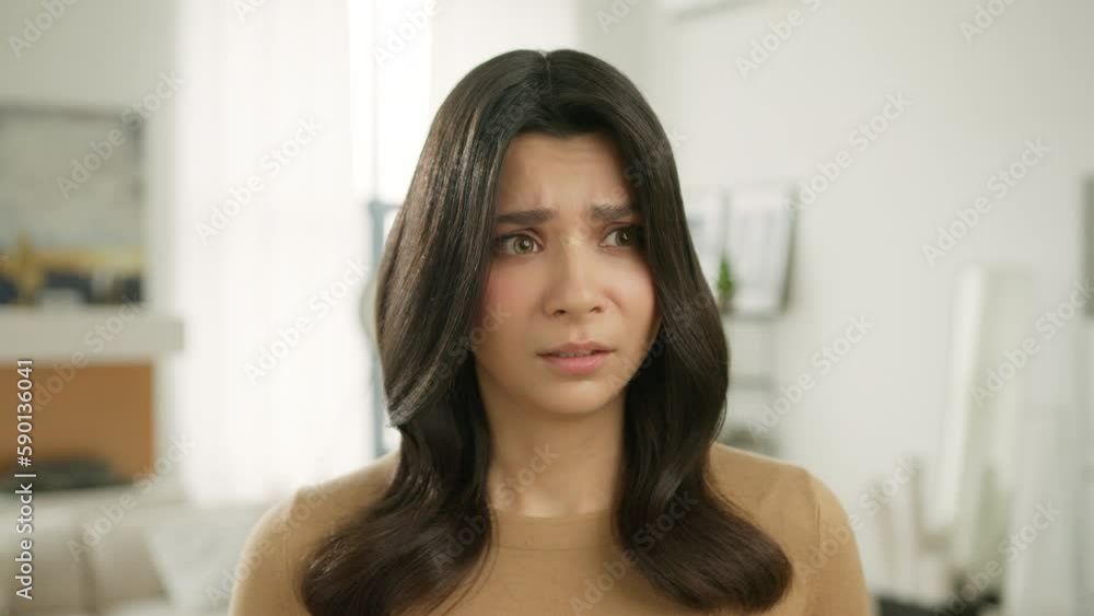Sad depressed young woman feeling bad. Girl stressed worried anxious ashamed, upset nervous female in trouble having problem, need psychological help posing to camera alone at home background 4K Sad depressed young woman feeling bad. Girl stressed worried anxious ashamed, upset nervous female in trouble having problem, need psychological help posing to camera alone at home background 4K