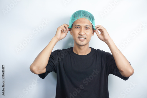 Asian youth wearing hairnet. isolated on white