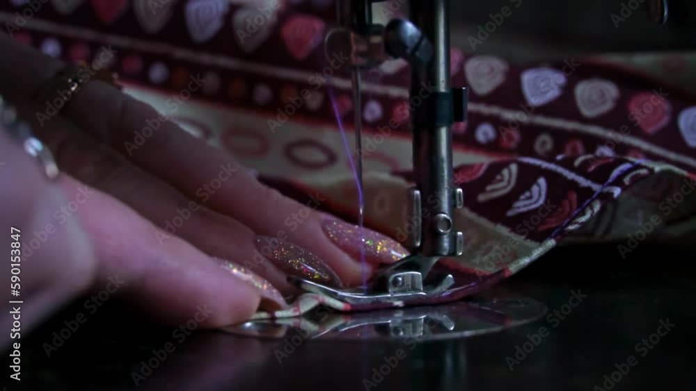 Vintage sewing machine needle in motion slow mo. Closeup of a sewing machine needle moving up