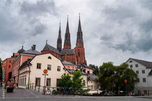Uppsala Cathedral, Sweden - church towers with waterfront and restaurant above the river.