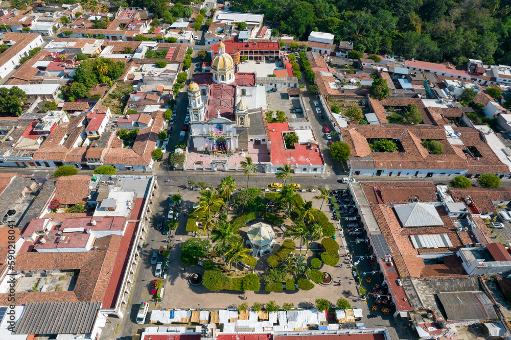 Aerial view of beautiful church in the magical town of Comala in Colima, Mexico, white town, wide angle photo.
