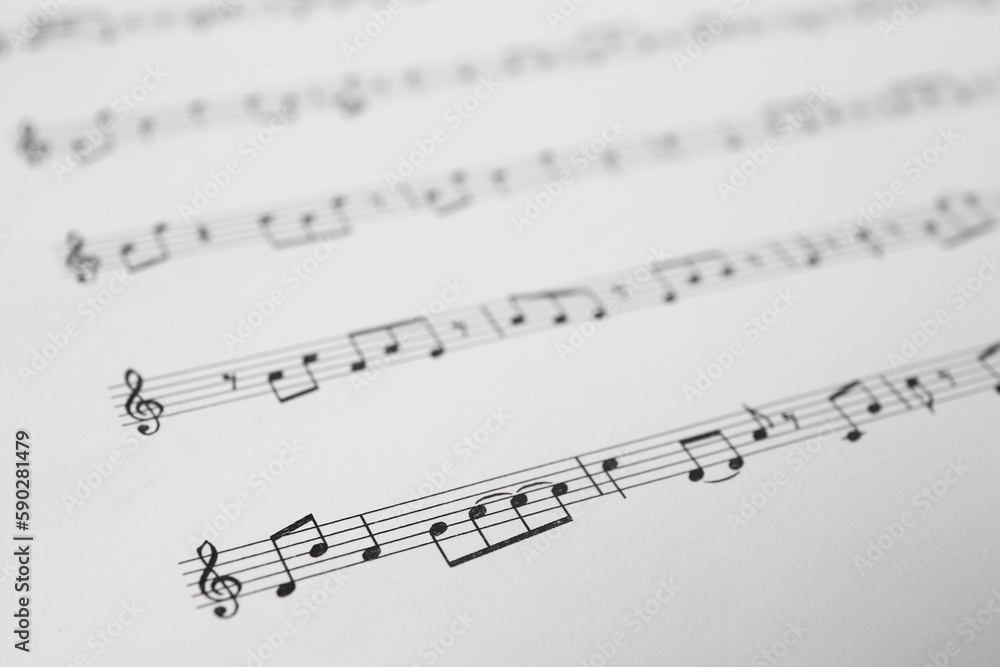 Sheet of paper with music notes as background, closeup Sheet of paper with music notes as background, closeup