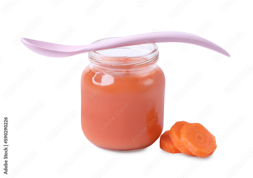 Jar of healthy baby food, carrot slices and spoon on white background Jar of healthy baby food, carrot slices and spoon on white background