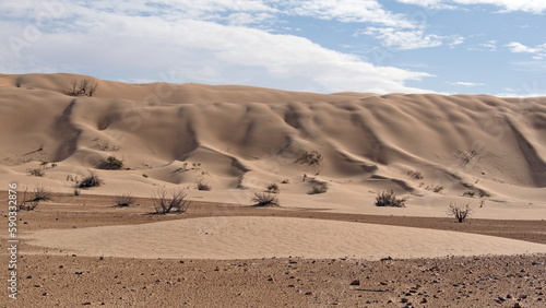 Tall dunes surrounding a valley in the Sahara Desert  outside of Douz  Tunisia