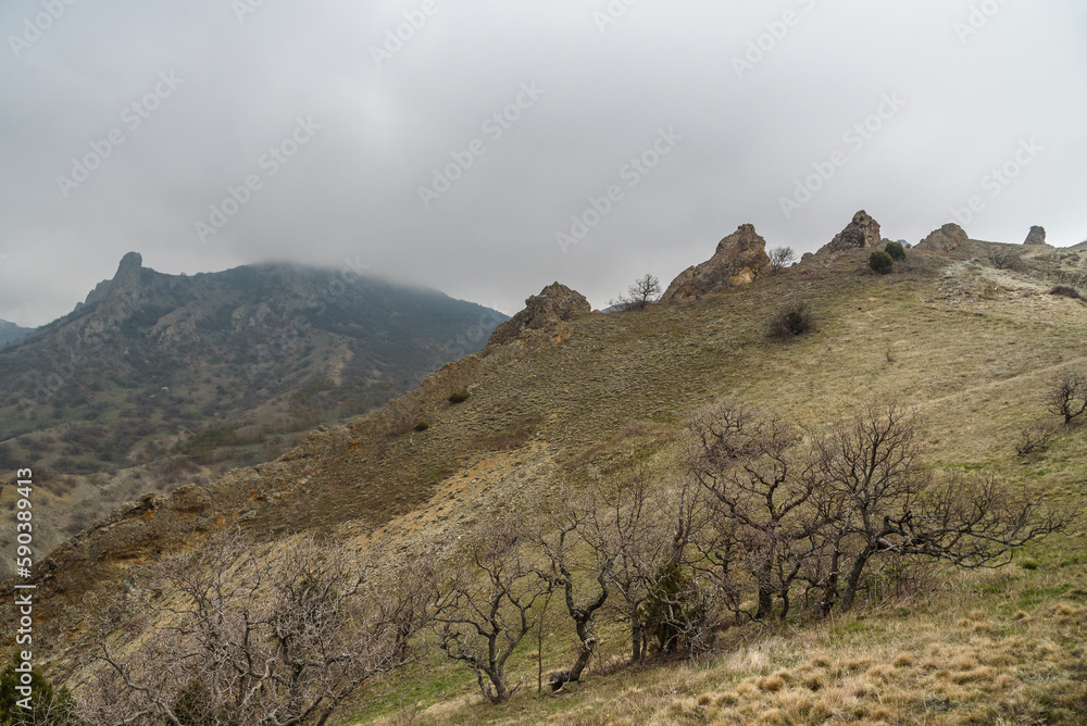Landscape of Karadag Reserve in spring. View of rocks of ridge Karagach. Crimea