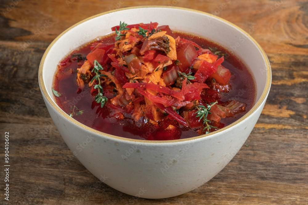 Beet and Chicken Soup in ceramic bowl. Beet and Chicken Soup in ceramic bowl.