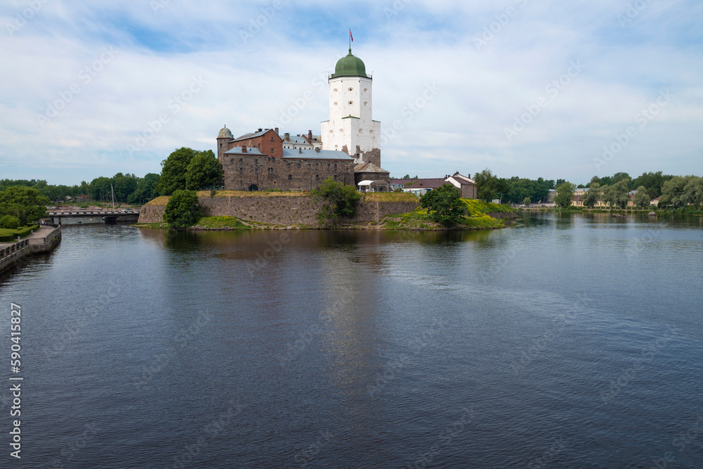 View of the ancient Vyborg castle from the Northern harbor on a July morning. Vyborg. Leningrad region, Russia