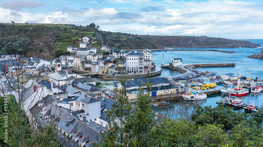 Tourist town of Luarca in Asturias with its fishing port with brightly colored boats, Spain. Tourist town of Luarca in Asturias with its fishing port with brightly colored boats, Spain.