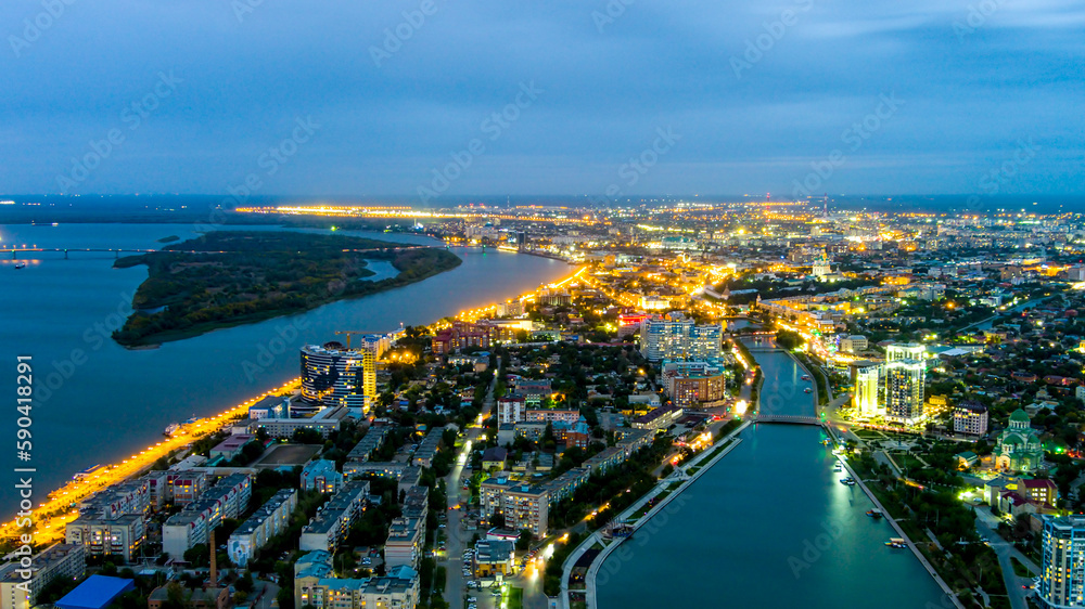 Astrakhan, Russia. Panorama of the city, twilight. Night city lights. Aerial view