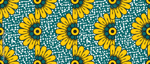 African wax print pattern. seamless beautiful Kitenge, chitenge, dutch wax, and Angara style. fashion design in colorful. yellow botanical flowers on green background. African Wax Print Fabric.