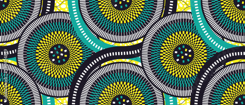 African ethnic traditional blue pattern. seamless beautiful Kitenge, chitenge, Ankara style. fashion design in colorful. Geometric circle motif. Curvy wave Ankara prints, African wax prints