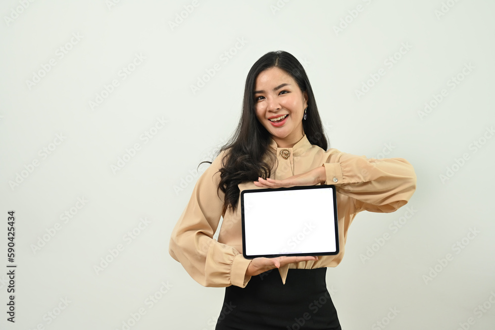 Smiling asian woman in business shirt showing digital tablet with empty screen standing isolated on white background Smiling asian woman in business shirt showing digital tablet with empty screen standing isolated on white background