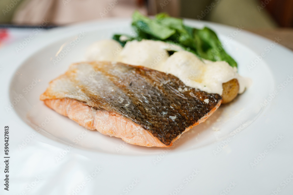 Grilled salmon on a plate in a restaurant Grilled salmon on a plate in a restaurant
