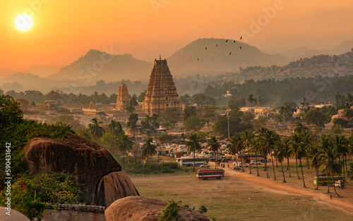 Virupaksha temple with scenic Hampi landscape and cityscape at sunset at Karnataka India photo