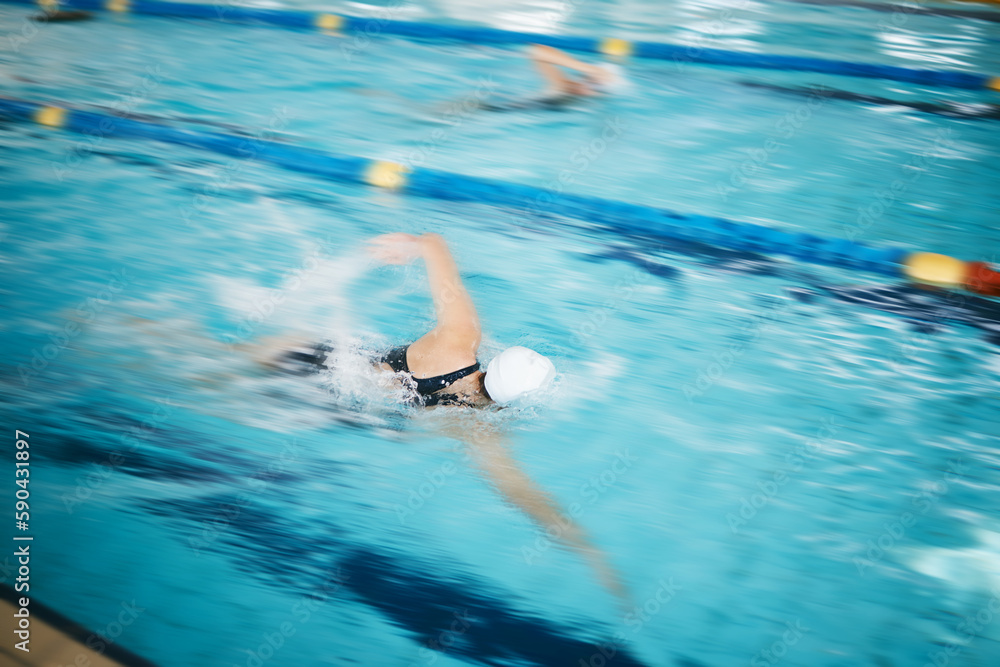 Obraz premium Sports, water splash or women in swimming pool for a race competition, exercise or cardio workout. Fast swimmers, freestyle stroke or healthy girl athletes racing with fitness speed or motivation