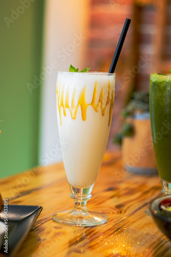 HOMEMADE MILKSHAKE IN GLAS WITH STRAW 