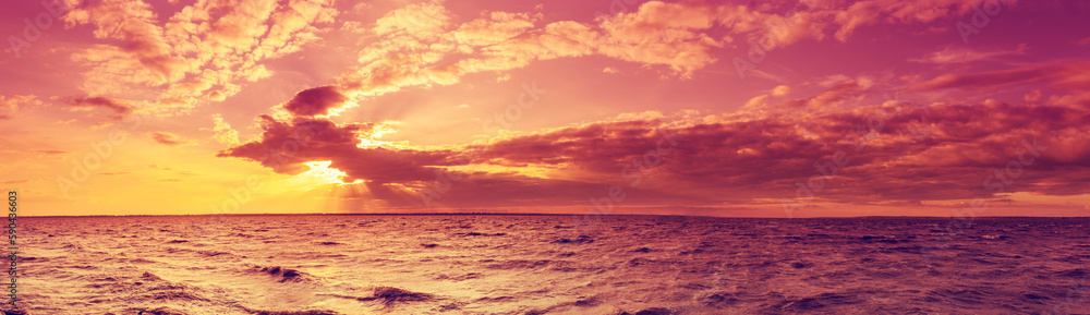 Seascape in the evening. Sunset over the sea with the beautiful blazing sky
