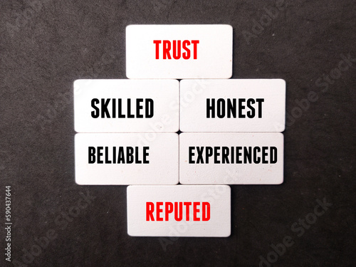 Wooden board with word TRUST,SKILLED,HONEST,BELIABLE,EXPERIENCED